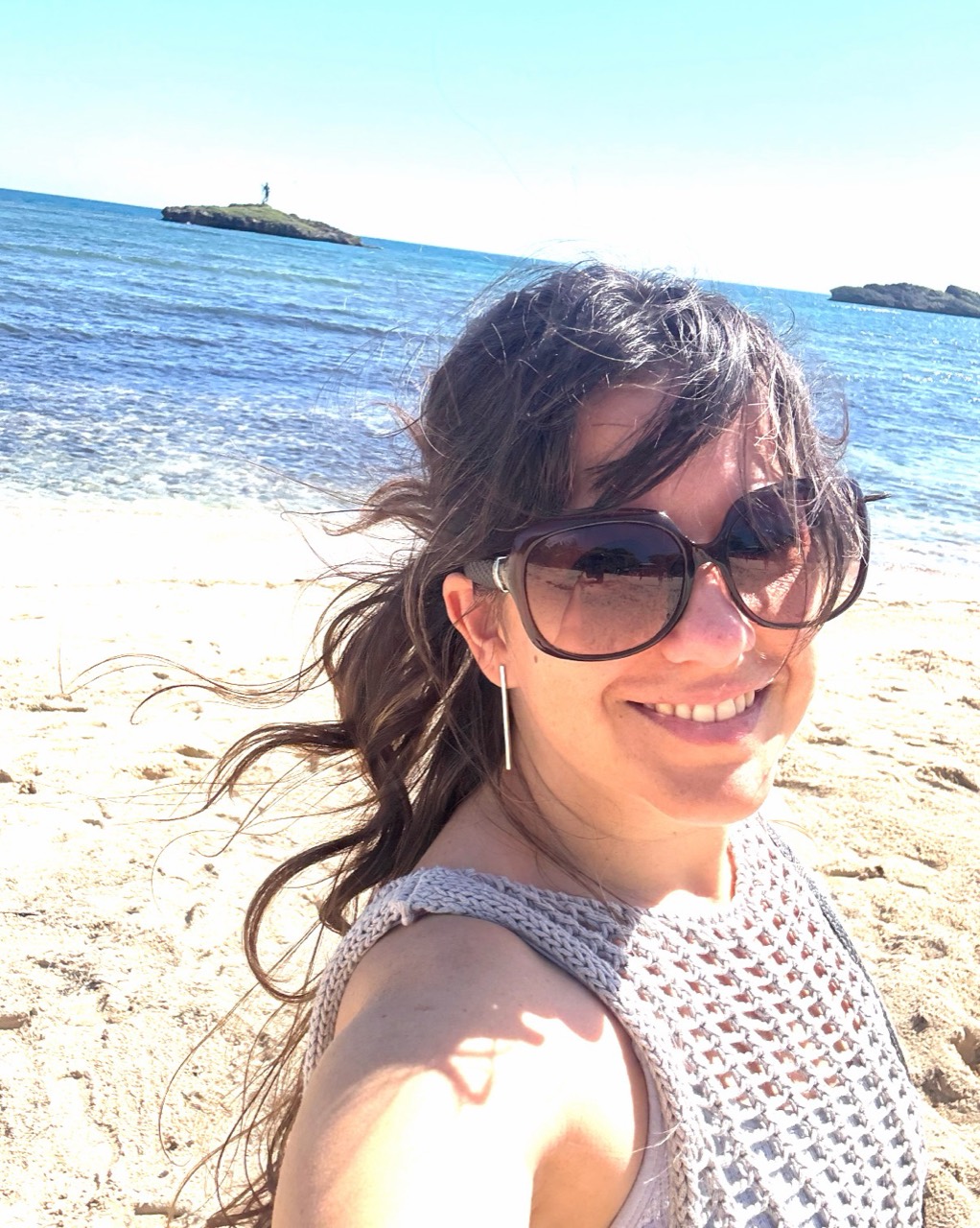 Miranda smiling at the beach